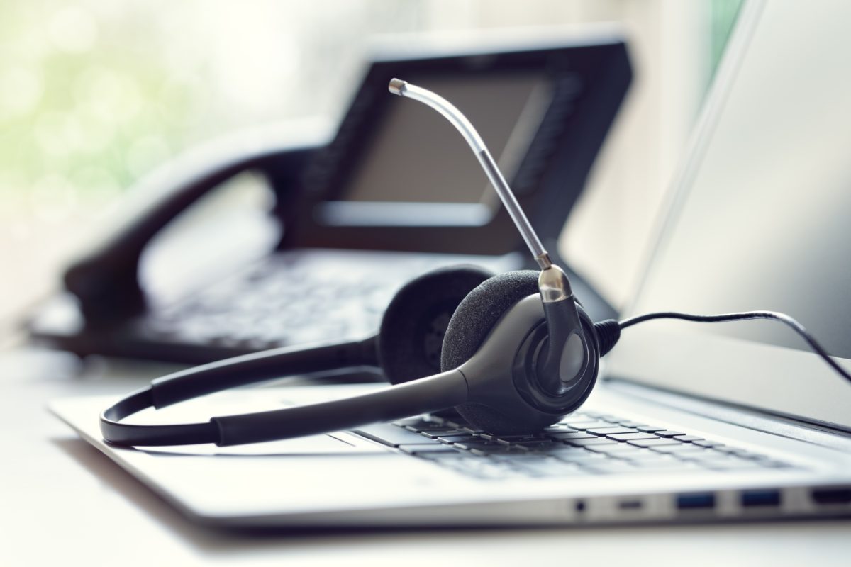 With Unified Communication Systems you can use desk phones, laptops, and/or mobile devices for VoIP calls and more. Image of a desk phone, laptop, and headset.