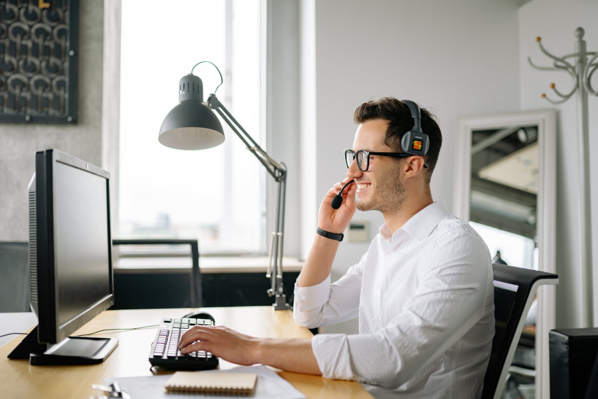 Choosing the Best Phone System for Insurance Agents. Image of an insurance agent on a phone call.