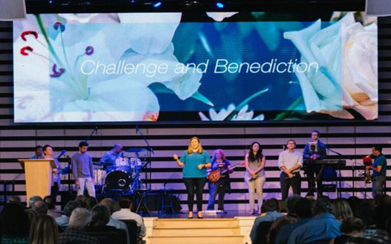 Discover how St. Luke's United Methodist Church reduced costs and improved communication by integrating Intulse's VoIP system with Rock RMS, streamlining operations and support. An image of worship at St. Luke's.